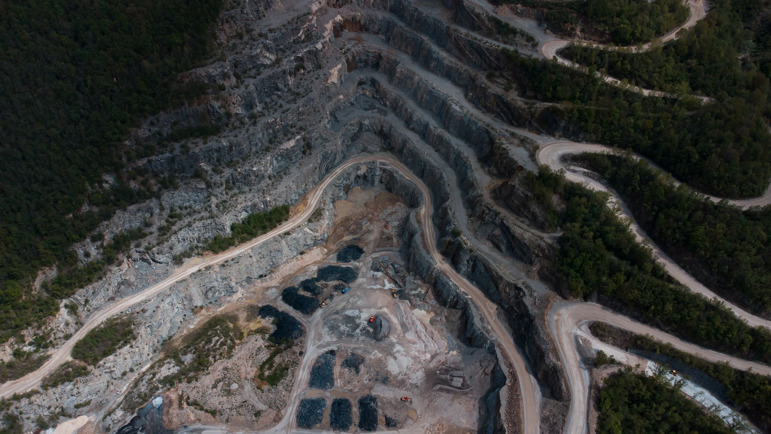 Aerial view of quarry terrain showing exposed earth layers