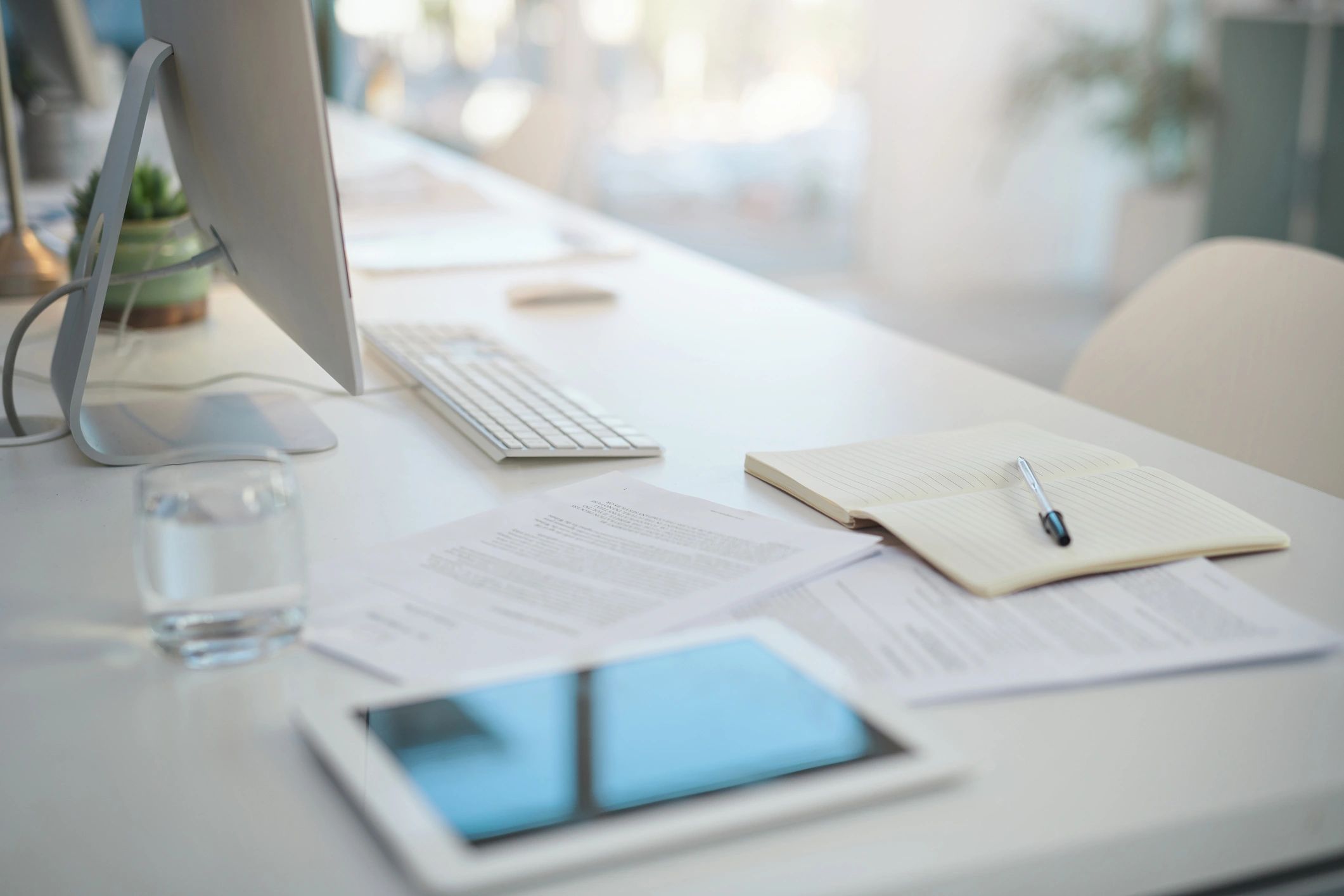 Desk with documents and investigative materials in a modern office