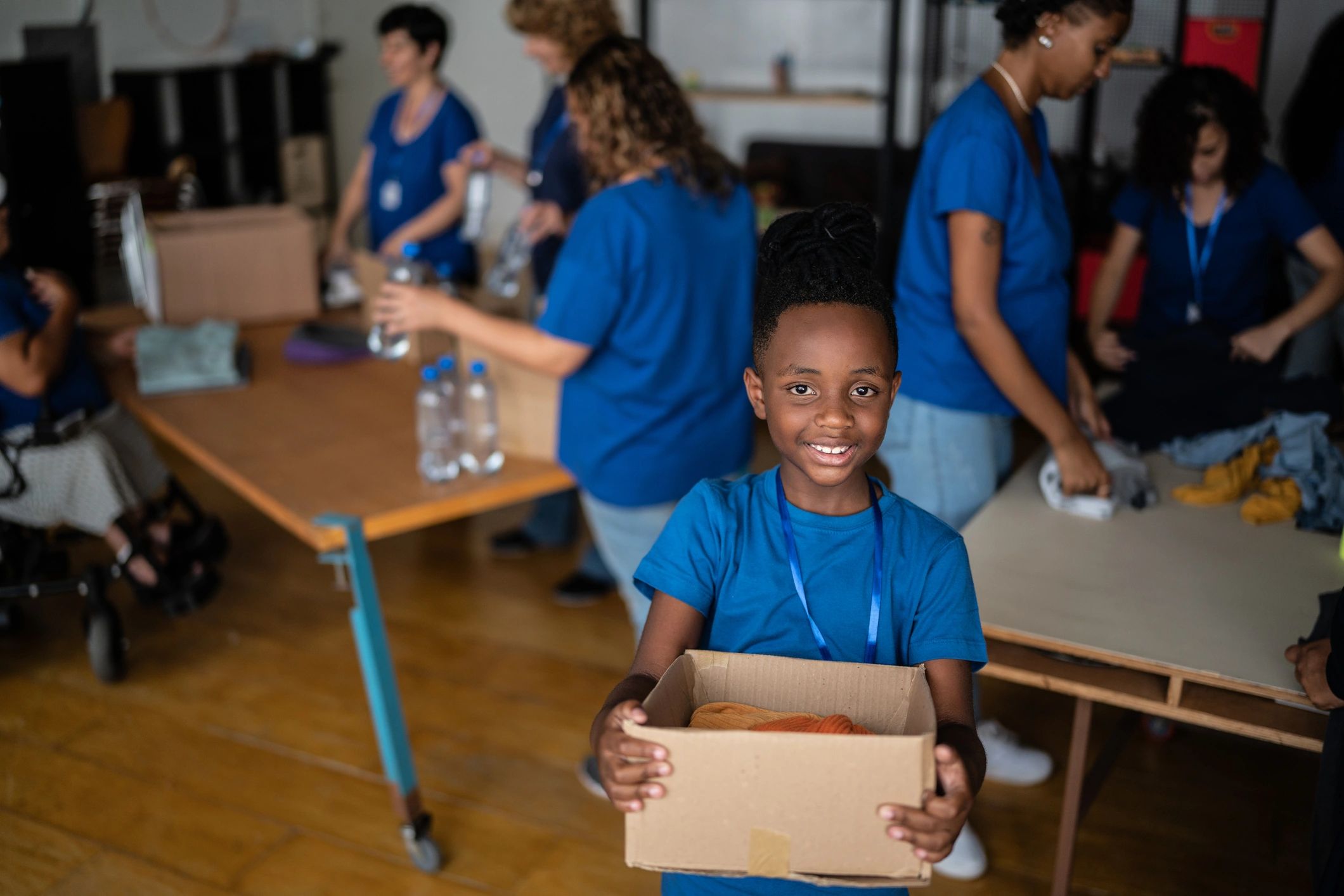 Boy holding a charity donation box