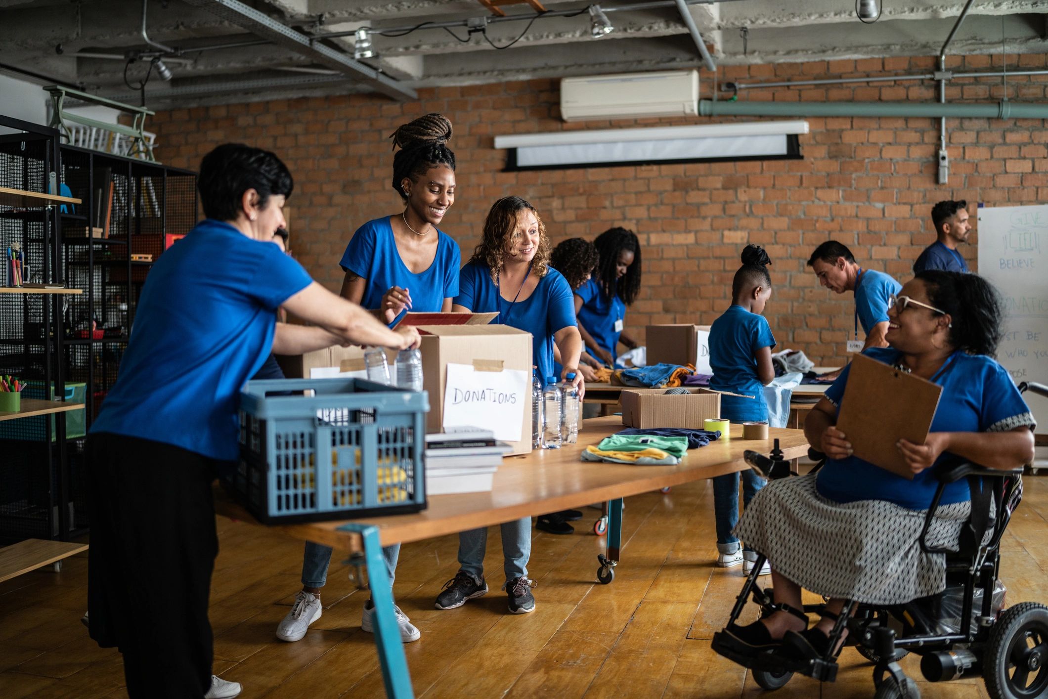 Volunteers organizing humanitarian aid supplies in a community relief setting