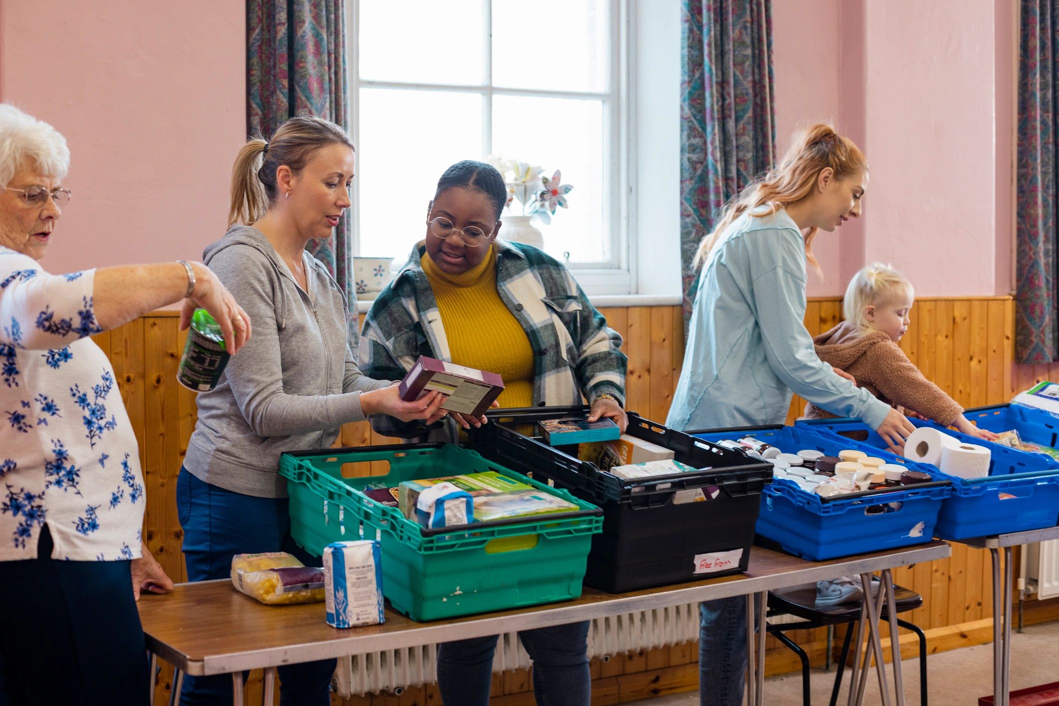 People receiving support at a community humanitarian aid distribution