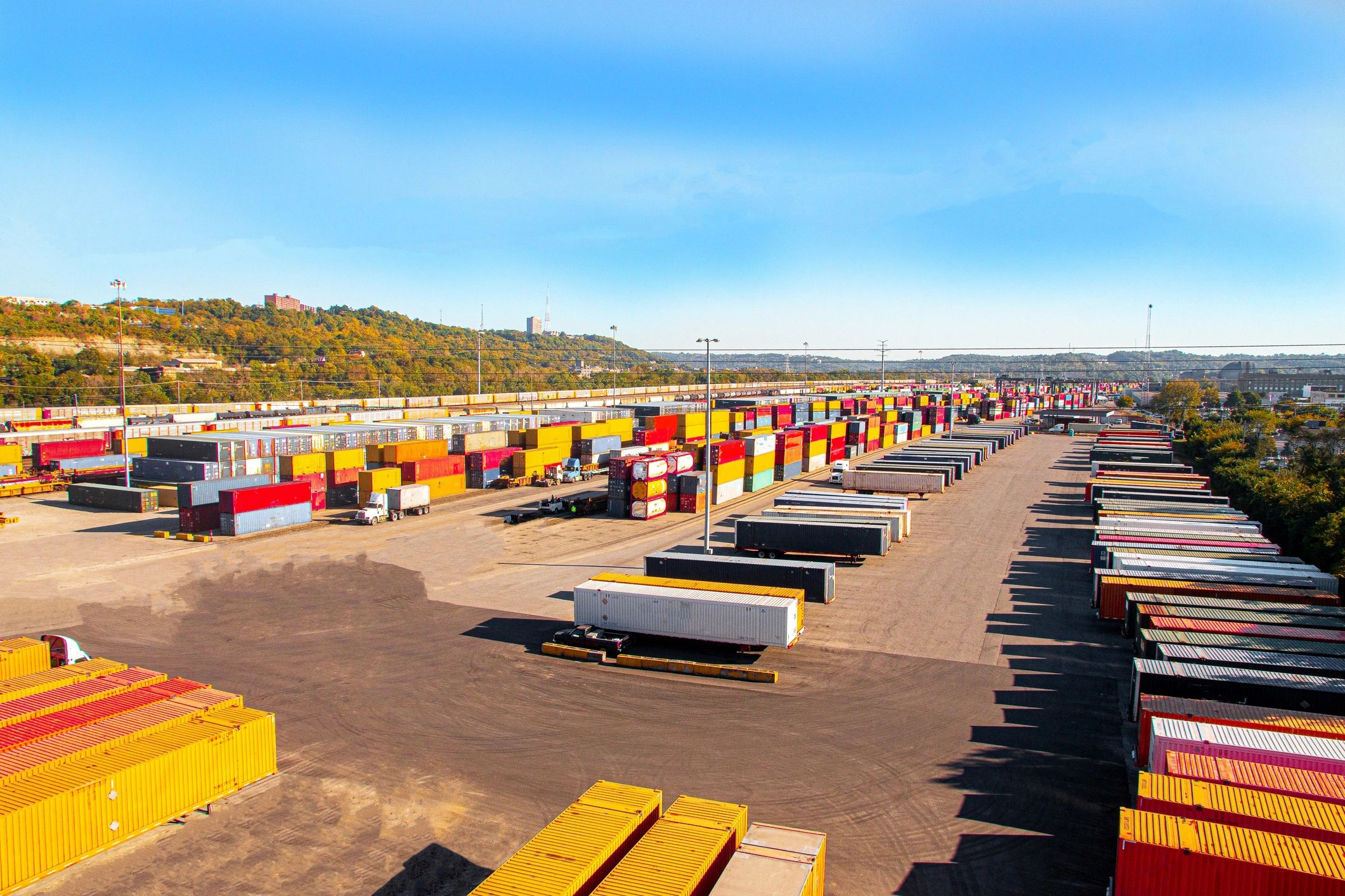 Shipping yard with cargo containers and transport infrastructure