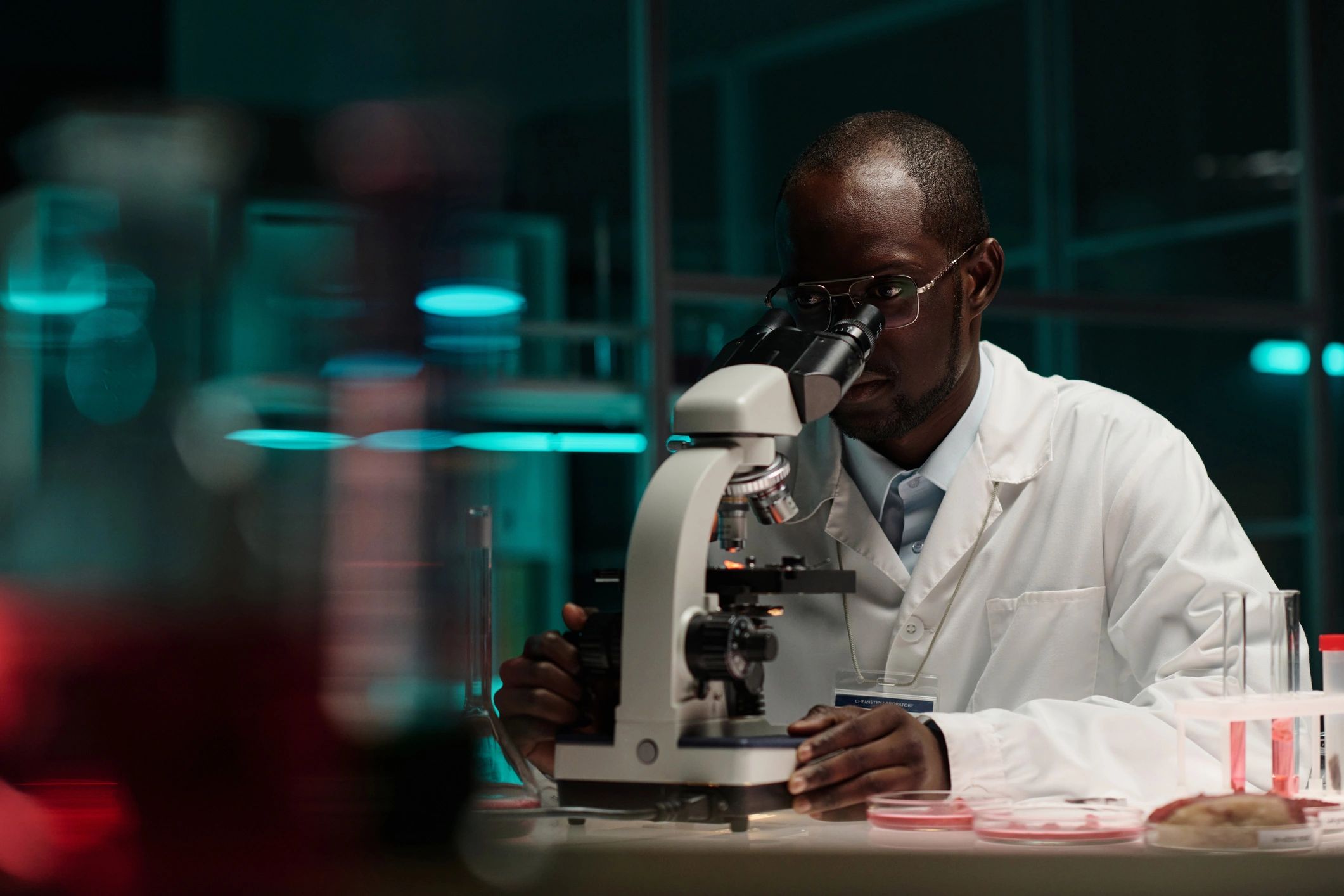 Researcher using a microscope in a professional laboratory
