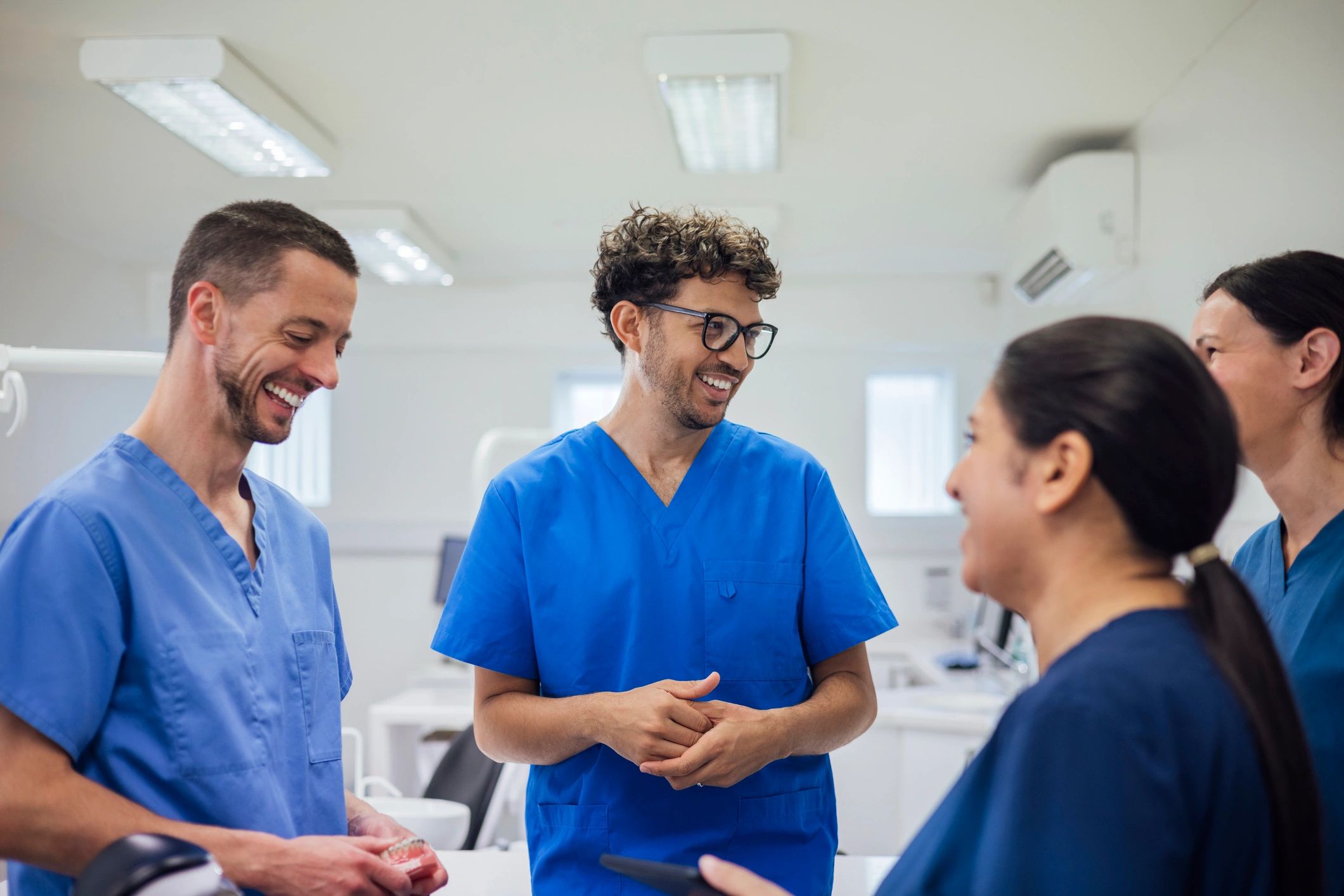 Healthcare professionals in discussion during operational review