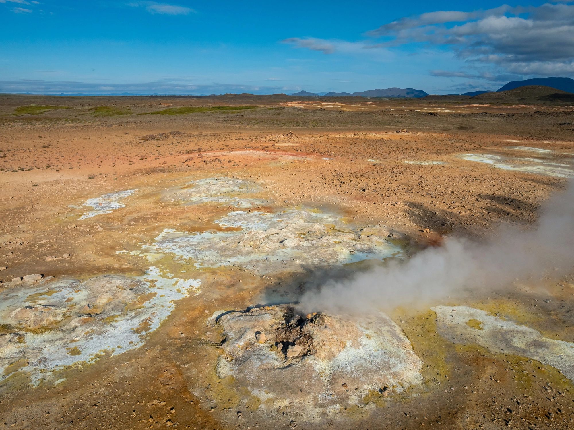 Aerial view of a volcanic geothermal landscape