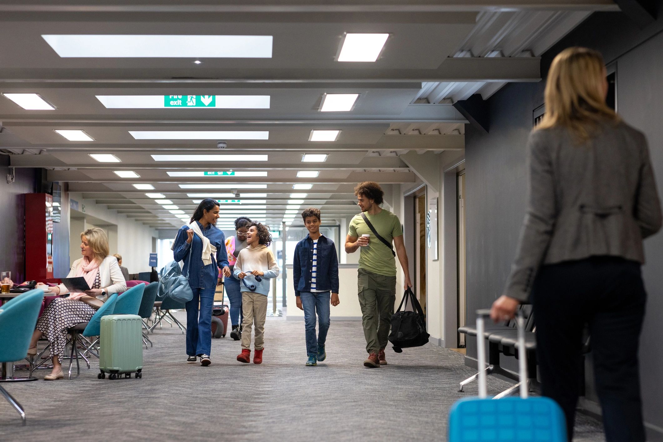 Travelers in airport terminal representing protected civilian movement