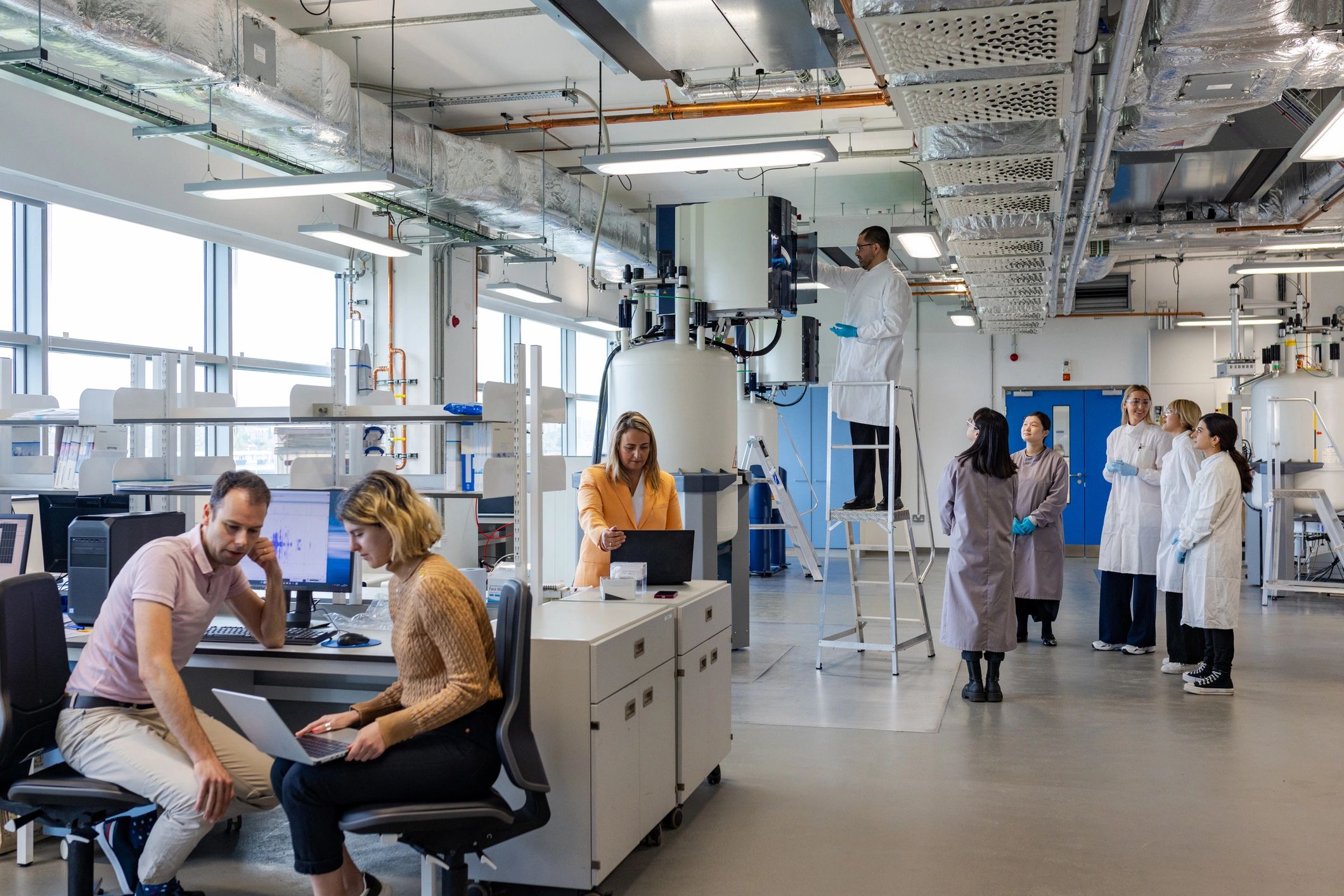 Scientific research team working together in a modern lab
