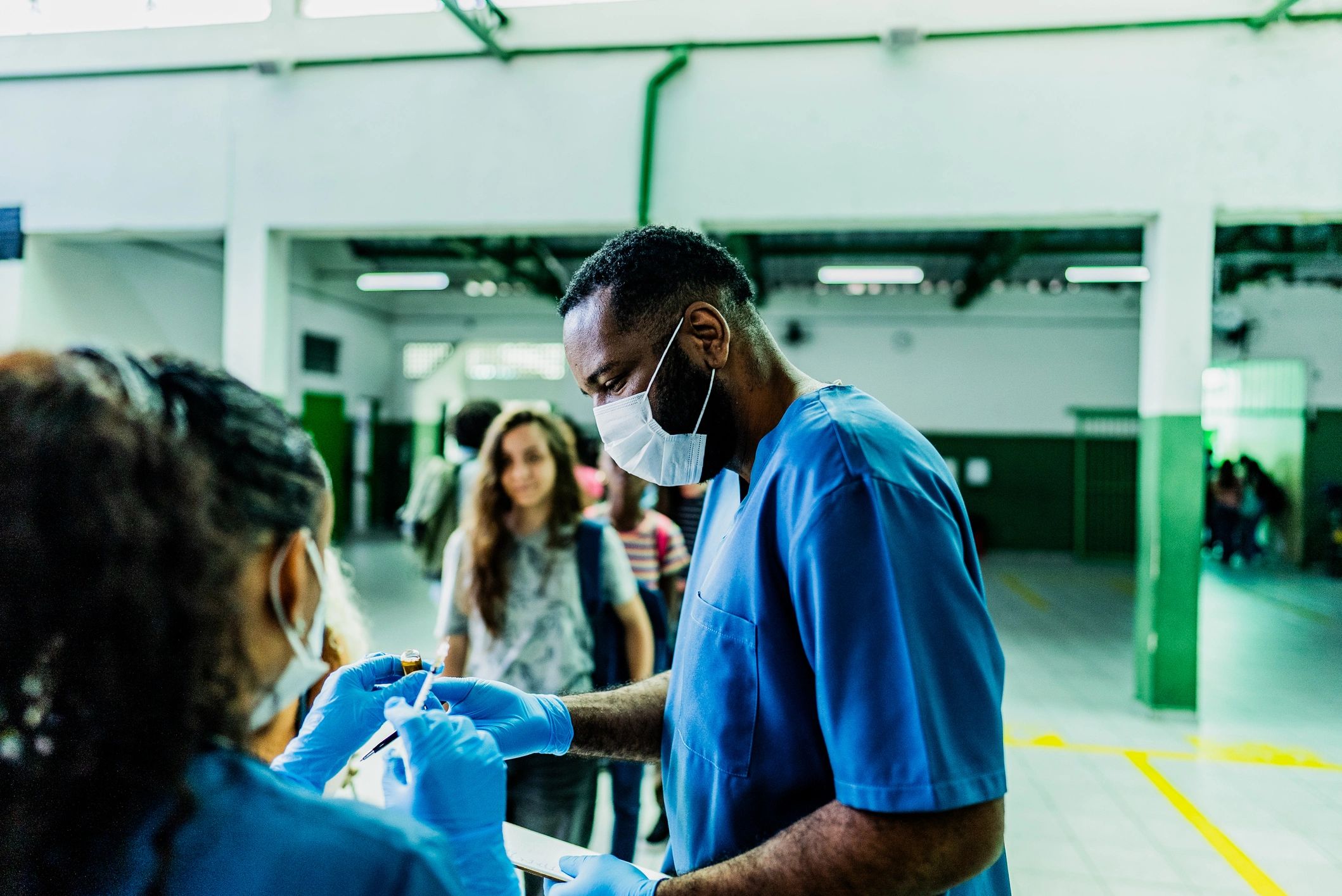 Healthcare worker preparing preventive treatment supplies